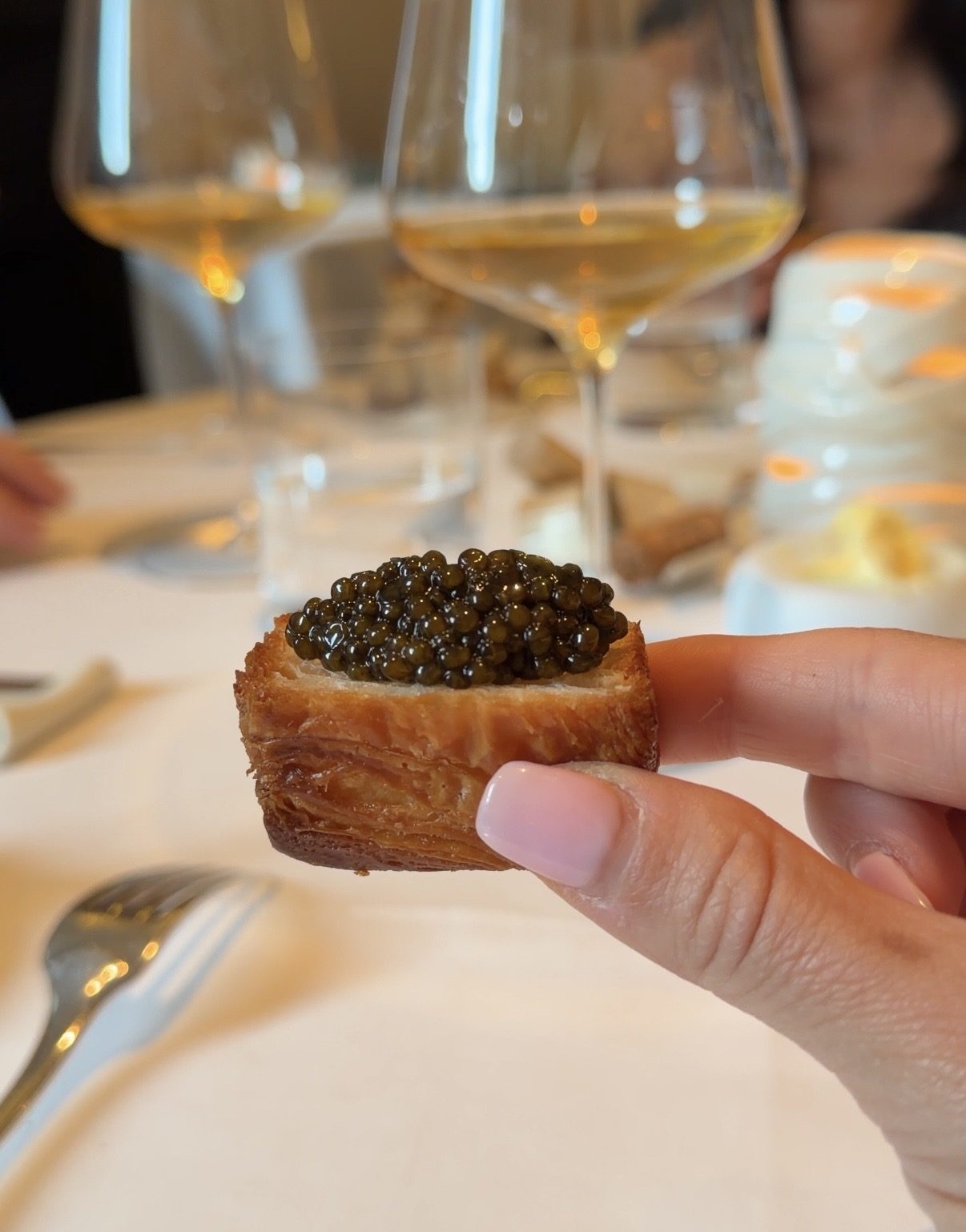 A square of puff pastry topped with caviar at Restaurant Alliance in Paris