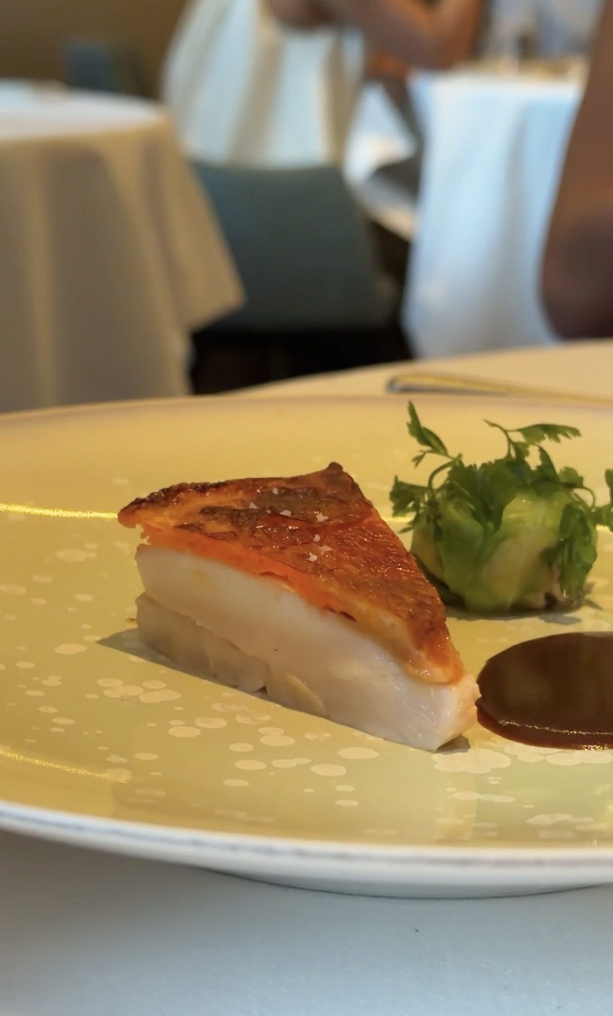 Layered course with a crisp browned top and a thick white center at Restaurant Alliance