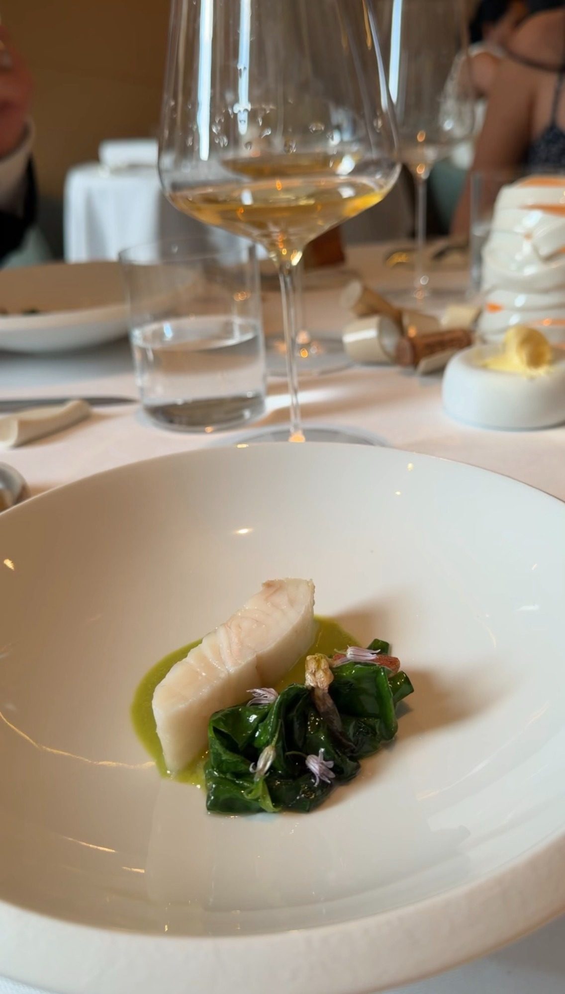 White fish fillet with greens and a green sauce at Restaurant Alliance in Paris