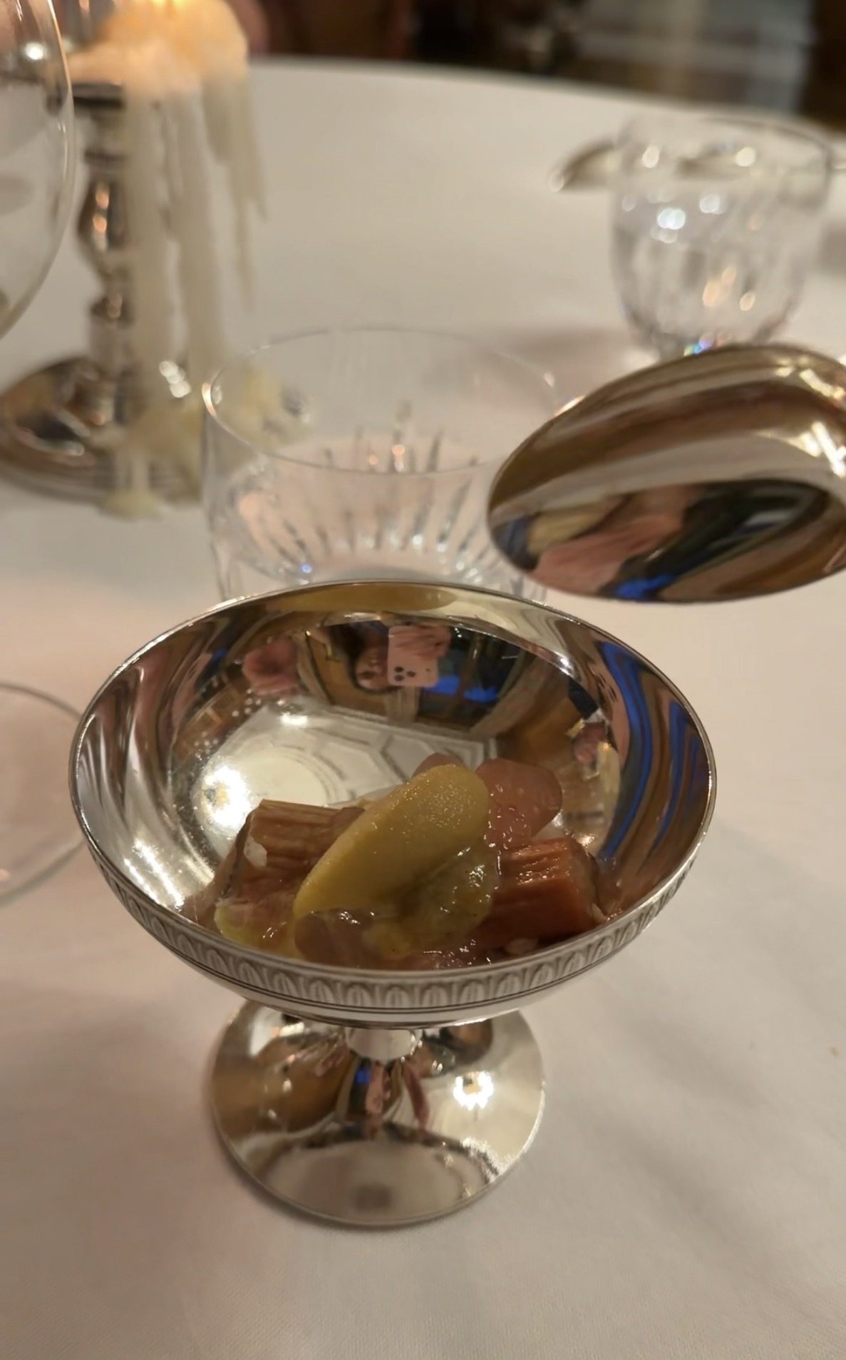Fruit in a silver coupe at Le Clarence, with rhubarb-colored pieces and a yellow fruit