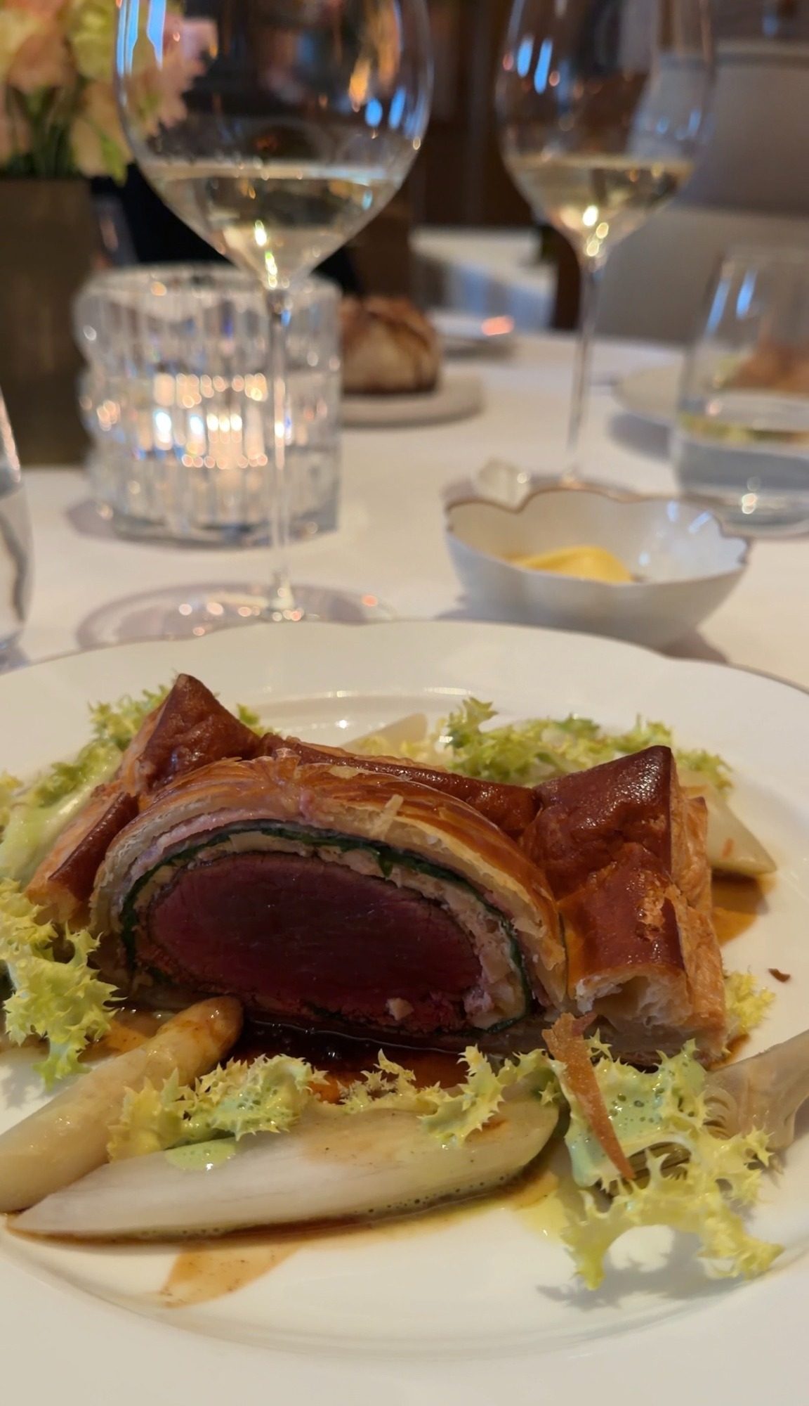 Rare beef baked in pastry with white asparagus at Le Taillevent in Paris