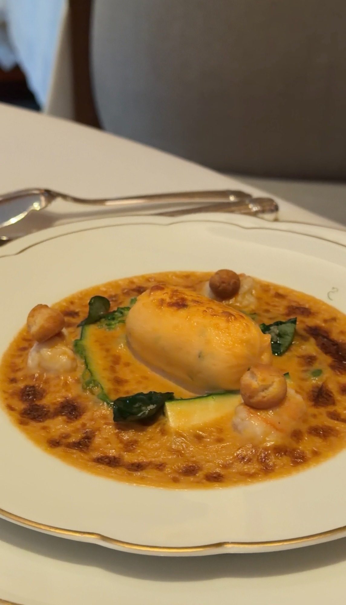 Orange sauce with zucchini and a golden center at Le Taillevent, one of the allergy substitutions